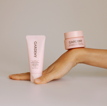 Gardeny Reset & Refresh Mini Duo balanced on a hand against a soft neutral backdrop, featuring the Rose PDRN Mask Cleanser mini and Rose PDRN Cleansing Balm mini. The composition highlights compact, travel-friendly sizing and the gentle rose-infused cleansing ritual powered by plant-based Damask Rose PDRN for hydrating, soothing daily skincare anywhere.