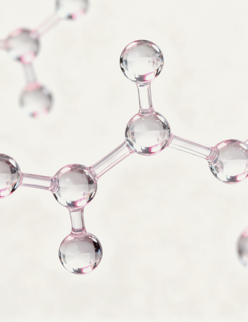 Close-up of soft pink-tinted molecular spheres representing Gardeny’s Damask Rose PDRN and Rose Callus Extract. The glossy structures also symbolize the 3-Peptide Complex that supports elasticity, smooths texture, and boosts firmness. Designed to communicate Gardeny’s blend of plant-derived PDRN with peptide-powered Korean skincare for hydrated, radiant, resilient skin.