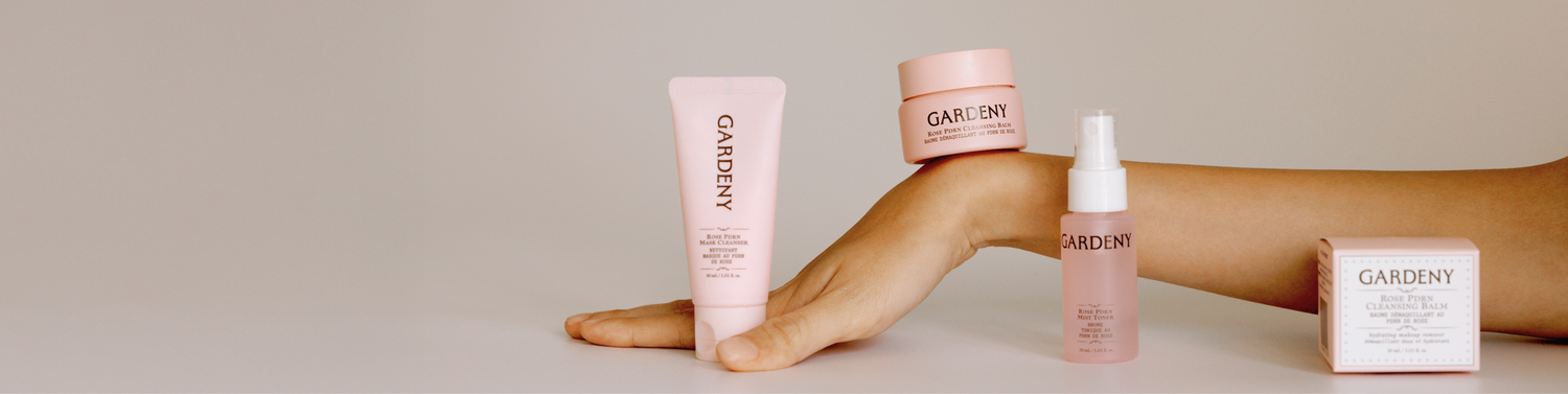 Gardeny Reset & Refresh Mini Duo featuring the Rose PDRN Mask Cleanser and Cleansing Balm balanced gracefully on a hand against a calm neutral background. The composition emphasizes Gardeny’s cream-to-foam wash-off ritual and hydrating cleansing system powered by plant-based PDRN, appealing to users searching for non-stripping Korean cleansers that keep skin moisturized, balanced, and comfortable while supporting barrier health and gentle daily renewal.