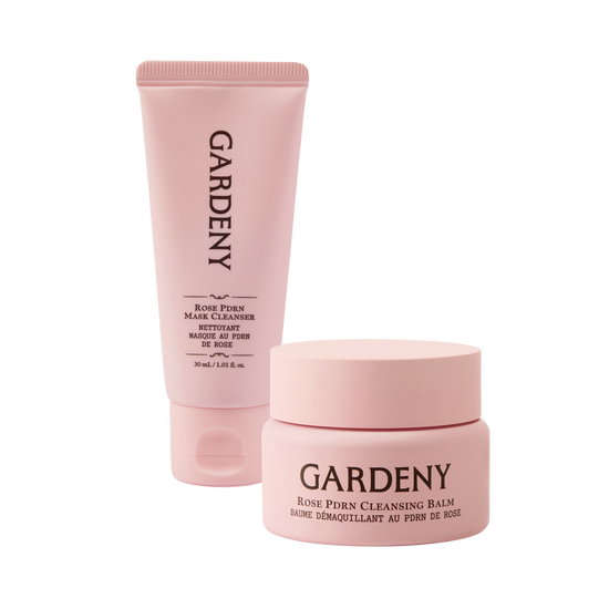 Gardeny Reset & Refresh Mini Duo displayed with the Rose PDRN Mask Cleanser and Rose PDRN Cleansing Balm in soft pink packaging. The scene highlights a complete two-step cleansing ritual that melts makeup, hydrates deeply, and refreshes skin anywhere. Emphasizes plant-based Damask Rose PDRN for radiance, moisture retention, and gentle daily skin renewal ideal for sensitive or dry skin.
