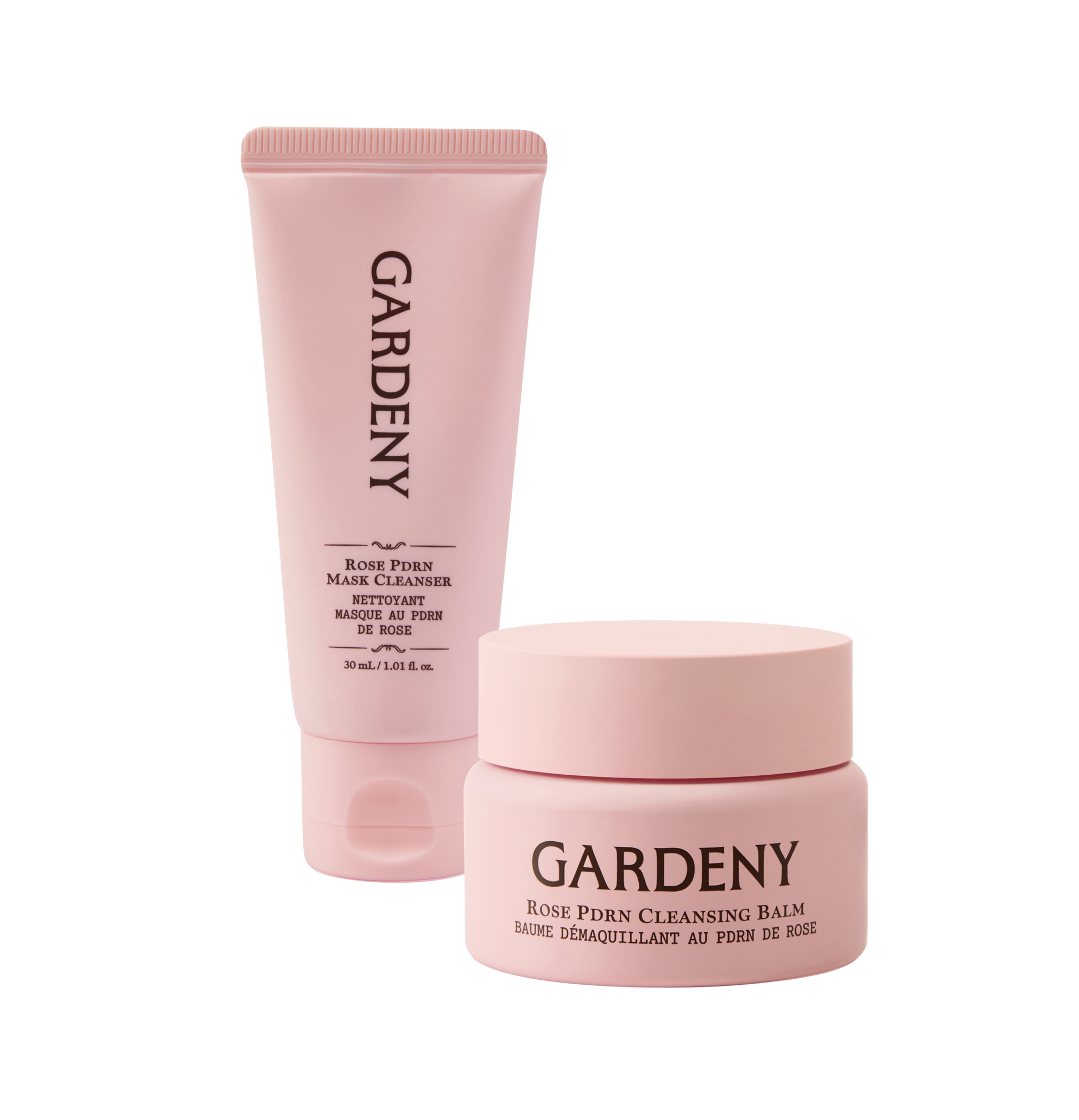 Gardeny Reset & Refresh Mini Duo displayed with the Rose PDRN Mask Cleanser and Rose PDRN Cleansing Balm in soft pink packaging. The scene highlights a complete two-step cleansing ritual that melts makeup, hydrates deeply, and refreshes skin anywhere. Emphasizes plant-based Damask Rose PDRN for radiance, moisture retention, and gentle daily skin renewal ideal for sensitive or dry skin.