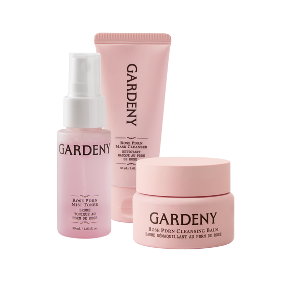 Gardeny Essential Mini Trio displayed on a clean white background, featuring the Rose PDRN Mist Toner, Mask Cleanser, and Cleansing Balm in soft pink packaging. The set highlights the complete 3-step routine designed to cleanse, hydrate, and revive skin with rose-powered moisture and gentle, skin-first formulas ideal for travel and on-the-go self-care.