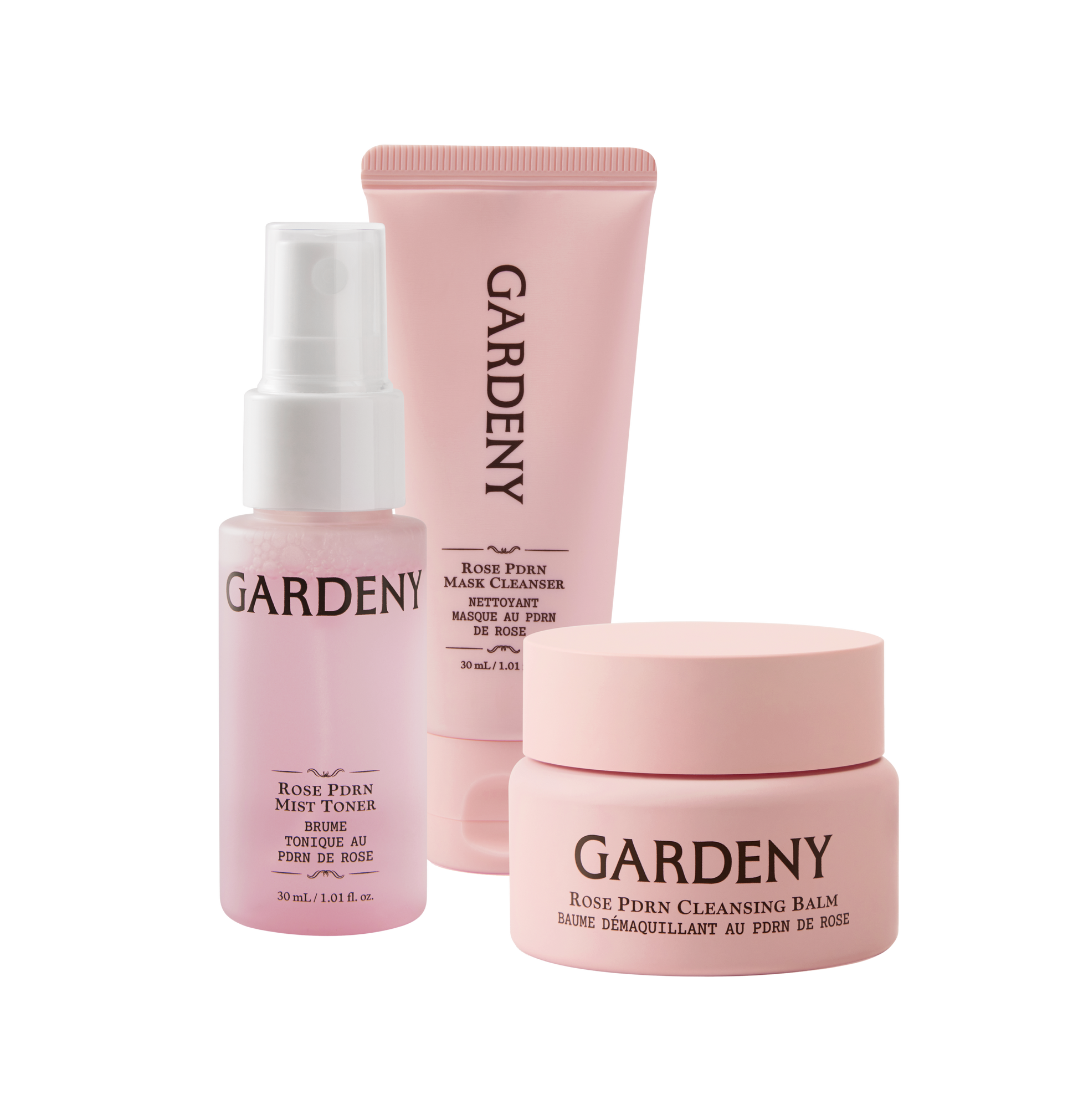 Gardeny Essential Mini Trio displayed on a clean white background, featuring the Rose PDRN Mist Toner, Mask Cleanser, and Cleansing Balm in soft pink packaging. The set highlights the complete 3-step routine designed to cleanse, hydrate, and revive skin with rose-powered moisture and gentle, skin-first formulas ideal for travel and on-the-go self-care.